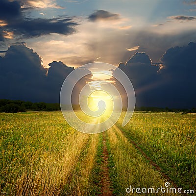 Dirt field road and sunset Stock Photo