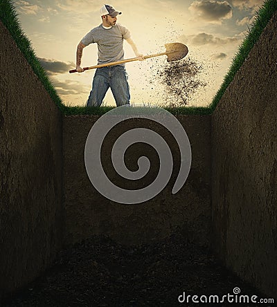 Dirt into a grave. Stock Photo