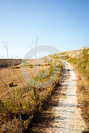 Dirt path winding through fields in the countryside around Wied Stock Photo