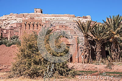 Dirt road amidst trees leading to the entrance of ancient fortress Stock Photo