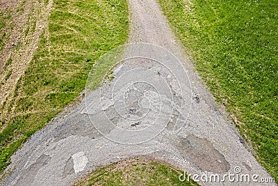 Dirt road crossroads seen from above. Stock Photo
