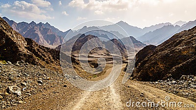 Dirt road in Hajar mountains in Dubai, UAE Stock Photo