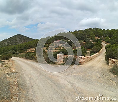 Dirt road. hinterland of the island of ibiza. crossroads. bifurcation Stock Photo