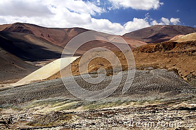 Dirt road leading through unreal dry barren landscape to Copiapo in Atacama desert, Chile Stock Photo