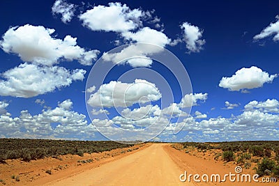 Chaco Culture National Historical Park, Remote Dirt Road under a Vast Sky in Southwest Desert Landscape, New Mexico, USA Stock Photo