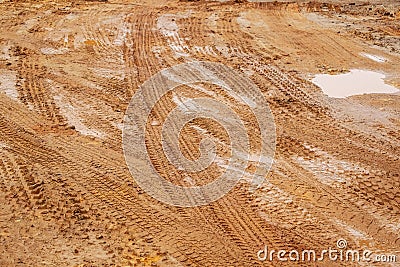 Dirt Road, Urban Non Asphalt Traffic Way with Tire Tracks of Many Type of Vehicles Stock Photo