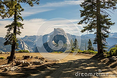 Dirt Road Winds Around Corner Below Half Dome Stock Photo