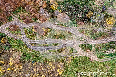 Dirt roads in wetland with puddles and mud after rain. aerial top view on off-road track Stock Photo