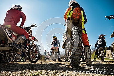 Dirtbike. Team Motocross on bike motorcycle is start road. rear view Stock Photo