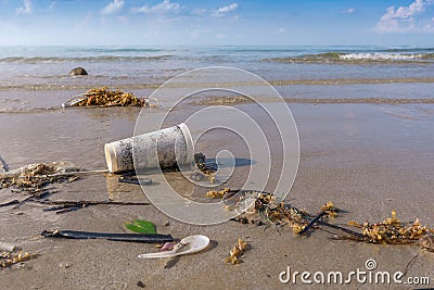 Dirty beach or Spilled garbage on beach Stock Photo