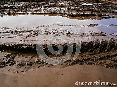 A dirty brown puddle. Slush from rain and passing trucks Stock Photo