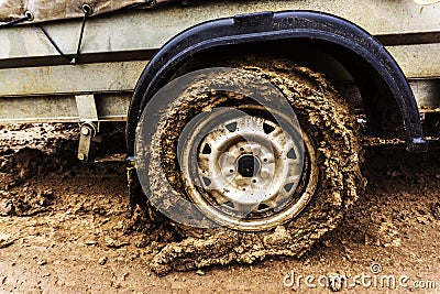 Dirty car wheel. Lack of paved roads. Close-up Stock Photo