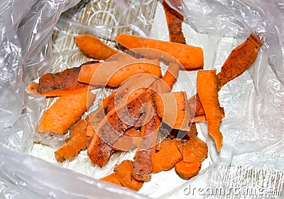 Dirty carrot peelings in a cellophane bag Stock Photo