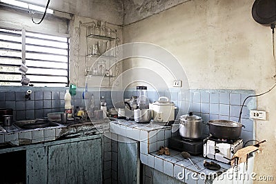 Dirty dark kitchen in an old beggar& x27;s house. A grim abstract sce Stock Photo