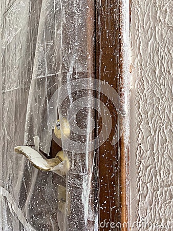 Dirty door after renovation dirtied with paint. Door need cleaning Stock Photo