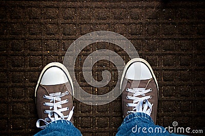 A dirty doormat fills the image, looking down Stock Photo