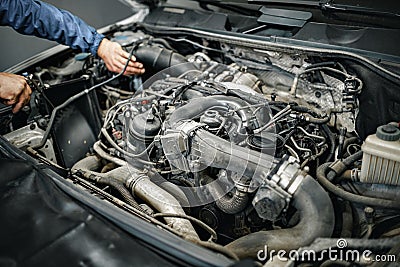 Dirty engine under the hood of a car Stock Photo