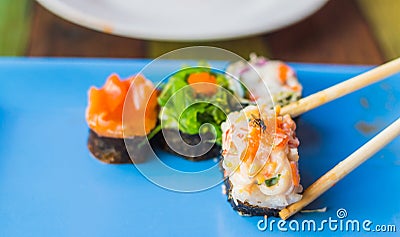 Dirty flies on a sushi. Stock Photo