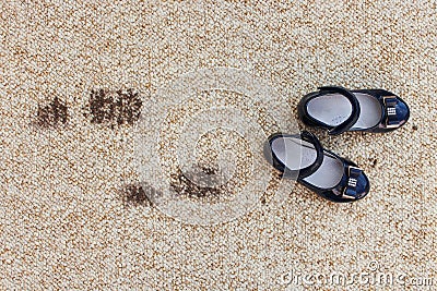 Dirty floor and children`s shoes. Stock Photo