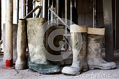 Dirty galoshes at a construction site Stock Photo
