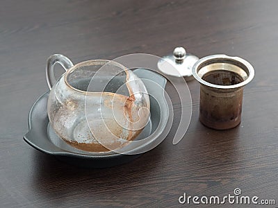 Dirty glass teapot. Tea scale on the teapot. Cleaning the teapot at home. Stock Photo