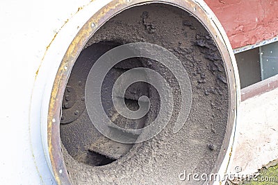 Dirty and greasy the blades of the radial fan vent closeup, require urgent cleaning Stock Photo