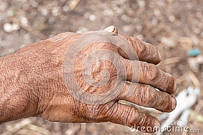 Dirty hands homeless poor man. - inequality problem concept.. Stock Photo