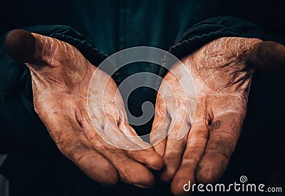 Dirty hands of a man, a working man, a man drained his hands while working, a poor man Stock Photo