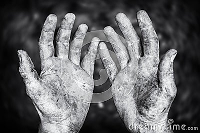 Dirty male hands after hard physical work in a black and white shot Stock Photo