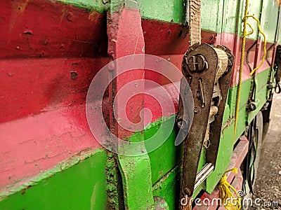 dirty old rope details and a dirty old canvas covered truck on a truck for transport. truck belt, safety Stock Photo