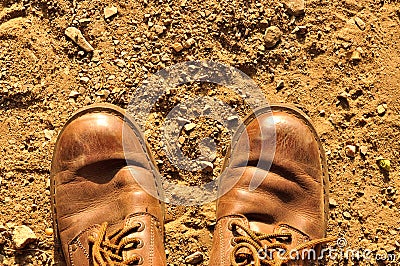 Dirty old shoes on dust floor Stock Photo