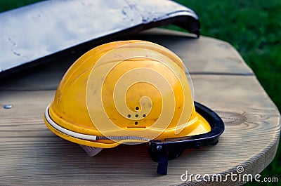 Dirty orange workman`s safety helmet Stock Photo