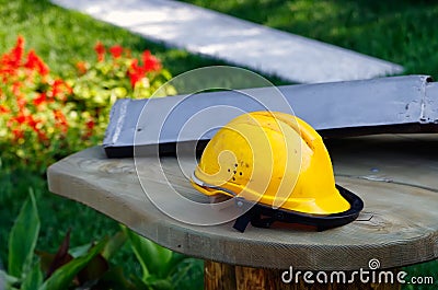 Dirty orange workman`s safety helmet Stock Photo