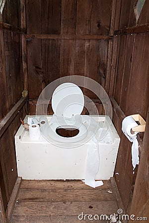 Dirty Outhouse Stock Photo