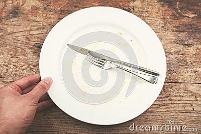 Dirty plate and cutlery Stock Photo