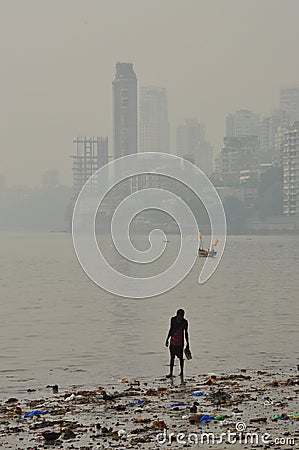Dirty polluted beach in Mumbai, India Editorial Stock Photo