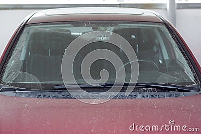 Dirty red car windscreen wipers. Stock Photo