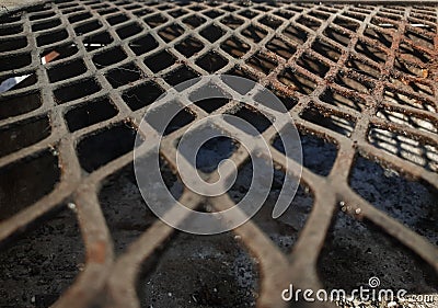 dirty rusted mesh used as a grill Stock Photo