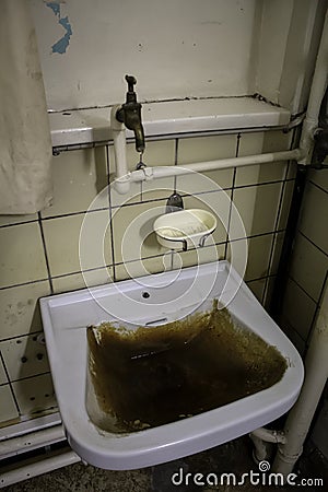 Dirty bathroom sink Stock Photo