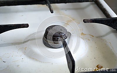 Dirty rusty switch off gas stove burner. Stock Photo