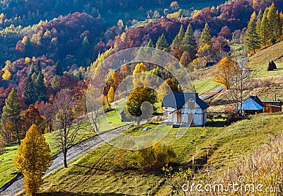 Dirty secondary road in autumn Carpathian mountain, Ukraine Stock Photo