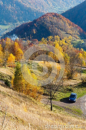 Dirty secondary road in autumn Carpathian mountain, Ukraine Stock Photo