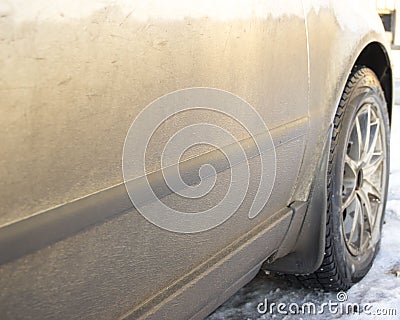 The dirty side of the car, with the front wheel Stock Photo