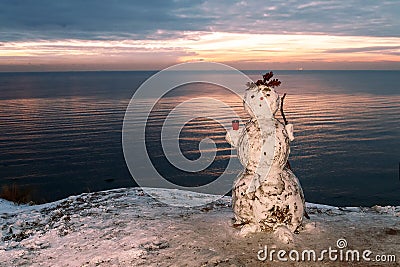 Snowman at sea Stock Photo