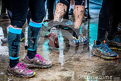 Legs and feet dirty after running on muddy trail Stock Photo