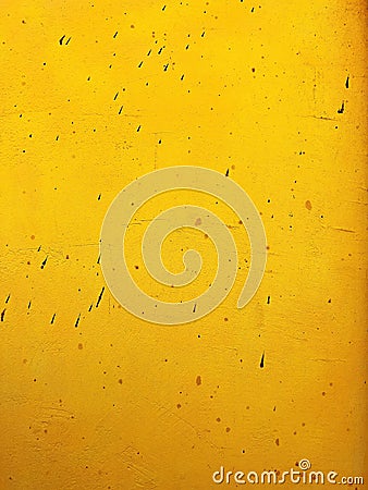 Dirty stained yellow concrete wall as grunge texture and background image Stock Photo