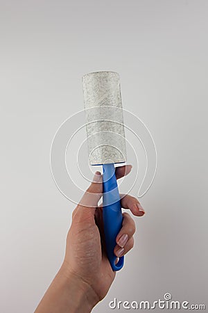 Dirty sticky roller for collecting dust Stock Photo