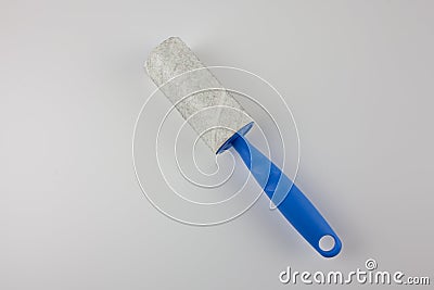 Dirty sticky roller for collecting dust Stock Photo