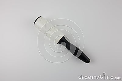 Dirty sticky roller for collecting dust Stock Photo