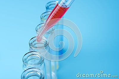 Dirty test tubes on blue background medical research. Stock Photo